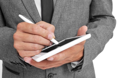 businessman using a stylus pen in his tablet